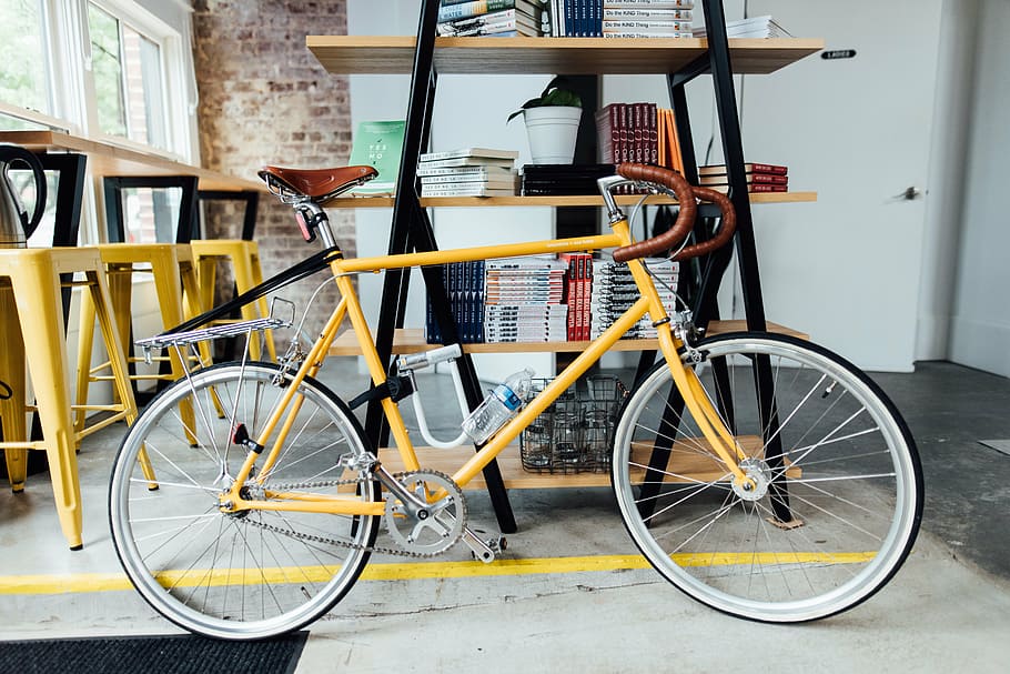 yellow, road bike, wooden, shelf, bicycle, bike, books, handlebars, indoors, spokes