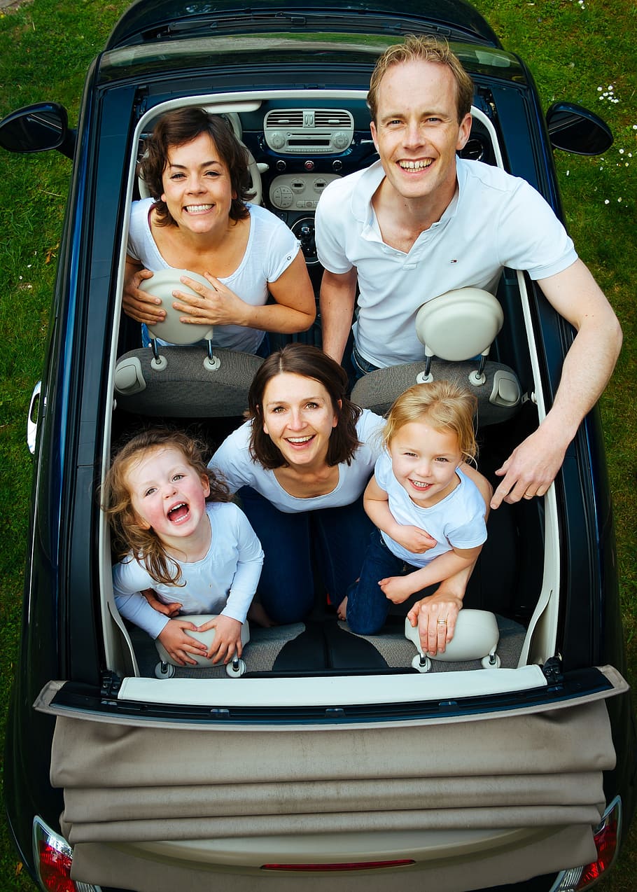 family, convertible, car, daytime, people, looking, children, man, woman, group