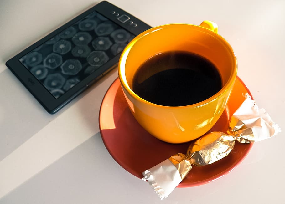 coffee, kindle, candy, morning, teacup, reading, breakfast, focus, peace of mind, orange
