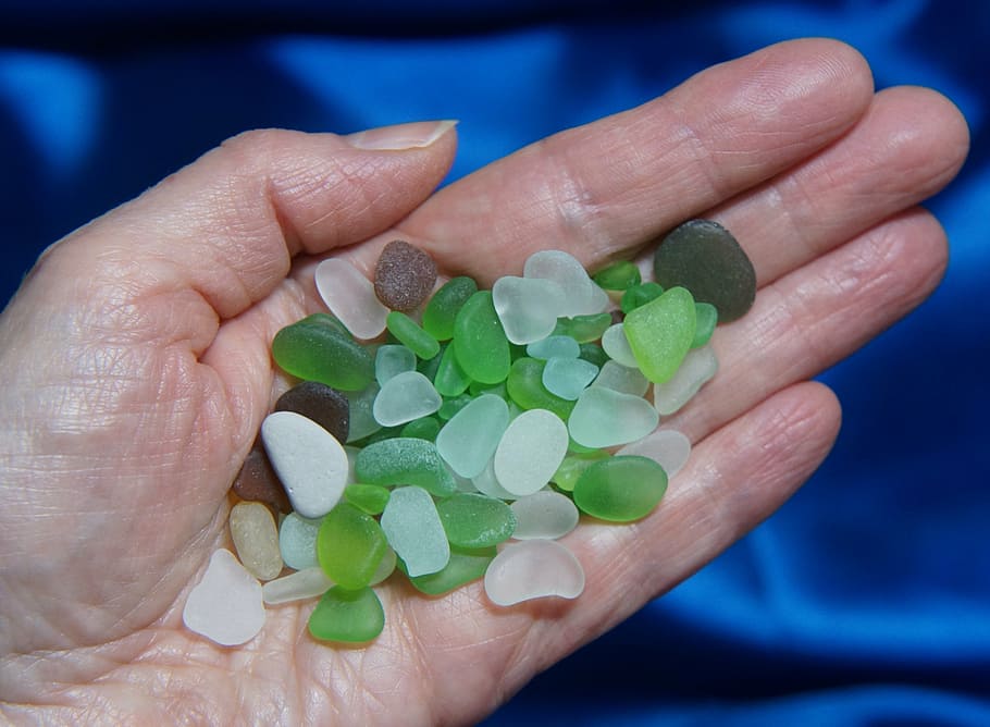 person, holding, green, white, stones, beach glass, glass, beach, ocean, sea