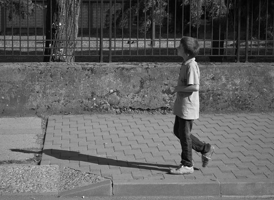 boy, street, walking, child, alone, black and white, real people, one person, full length, lifestyles