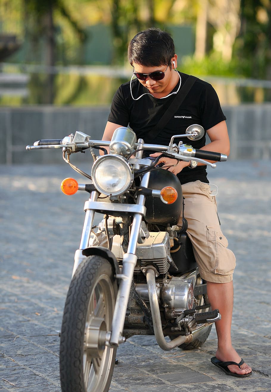 man, wearing, black, t-shirt, khaki, cargo shorts, riding, motorcycle, motorbike, vehicle