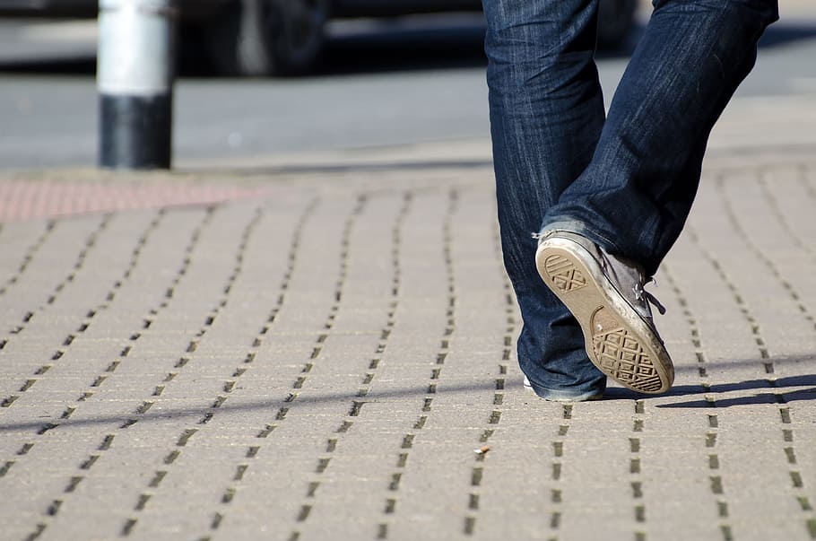 person, blue, jeans, white, sneakers, walking, concrete, road, in blue, blue jeans
