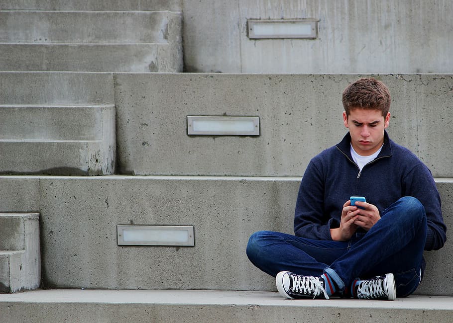 man, blue, jacket, sitting, concrete, stair, texting, boy, teenager, outdoor