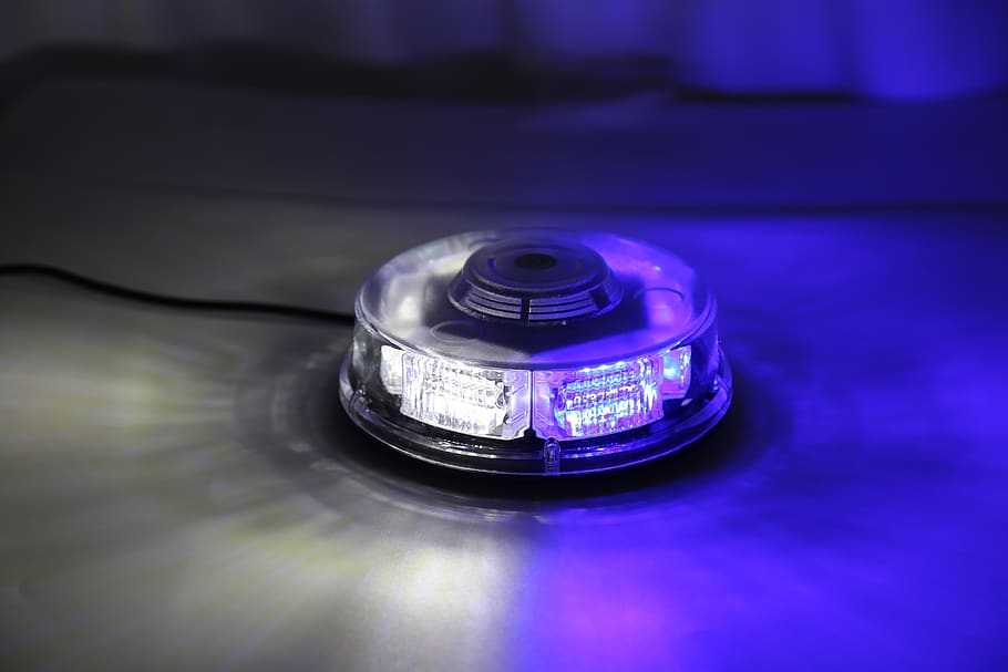 strobe lights, white blue, lights, indoors, table, blue, still life, close-up, metal, focus on foreground