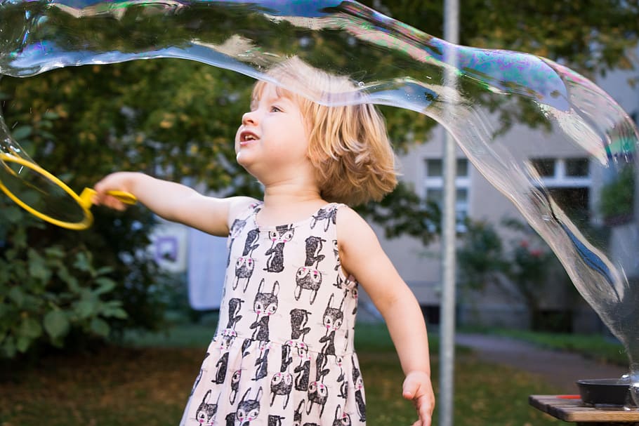 child, soap bubbles, play outside, make soap bubbles, children's, girl plays, childhood, girls, water, leisure activity