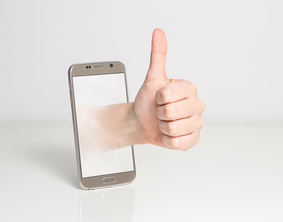 silver android smartphone, left, hand, white, background, thumbs up, good, alright, seal of approval, accept