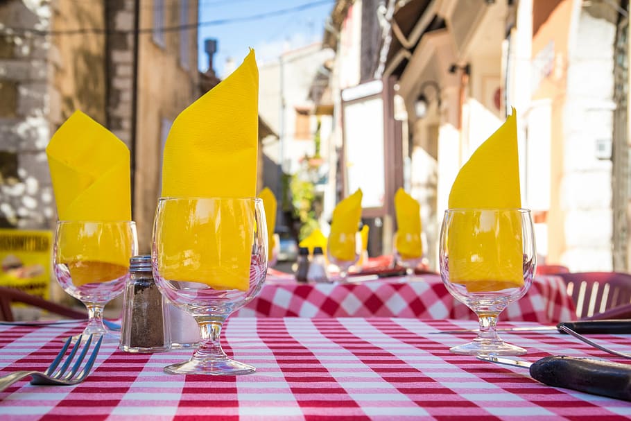 three, clear, glass footed cups, tabletop, napkins, tablecloth, cutlery, provence, south of france, france