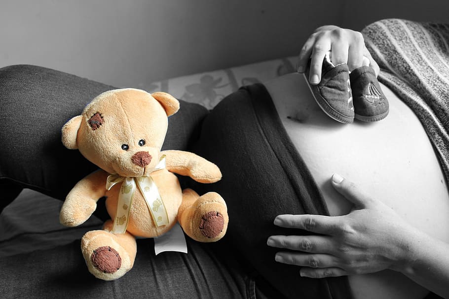 selective, color photography, woman, lying, bed, teddy, bear, lap, pregnancy, black