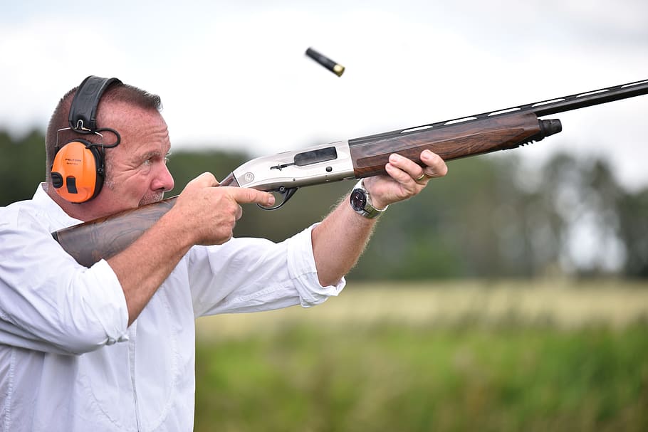 man, using, brown, hunting rifle, shooting, rifle, headphones, sports, focused, cartridge