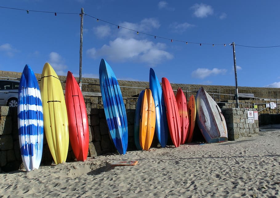 assorted-color surfboard lot, boats, sand, sea, port, color, colorful, england, cornwall, kayak
