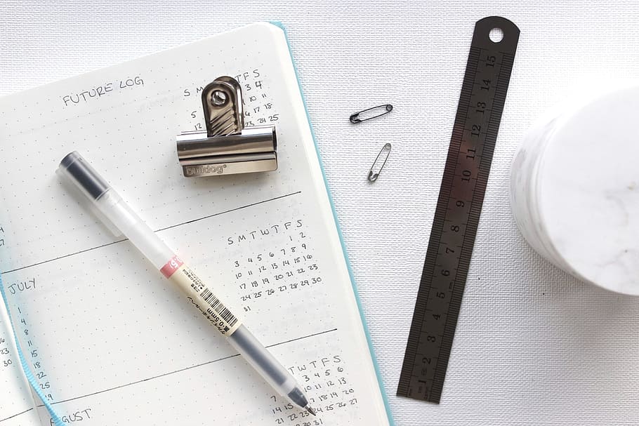 black ballpoint pen, calendar, pen, paper, clip, ruler, white, table, work, desk