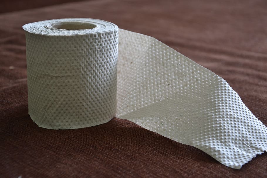 rolled toilet paper, toilet paper, paper, the tape, paper tape, grey paper, textile, indoors, close-up, table