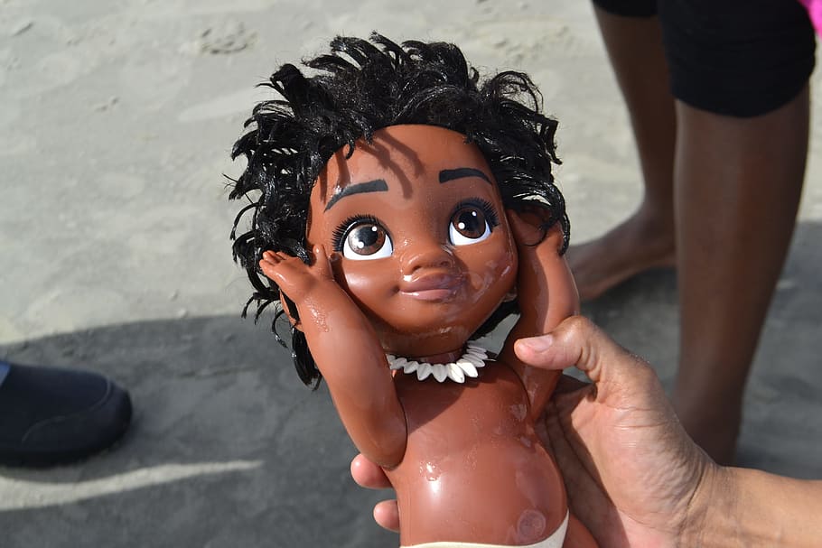 toy, baby, black doll, african american, black hair, sand, found, child, children, just born