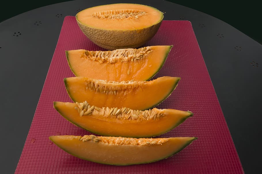 melon, orange, cores, knife, cut in half, district, eighth, cutting mat, food and drink, food