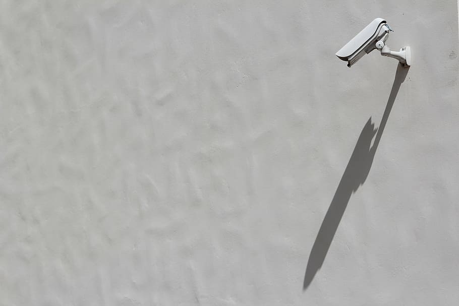 bullet security camera, mounted, white, painted, wall, camera, facade, spy, film, snowden