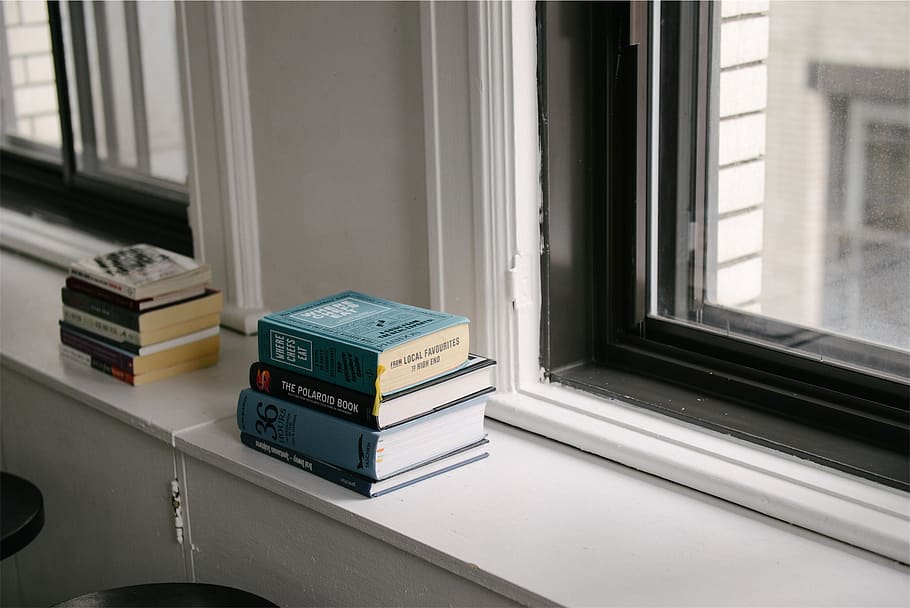 books, window, indoors, stack, day, large group of objects, close-up, publication, book, technology