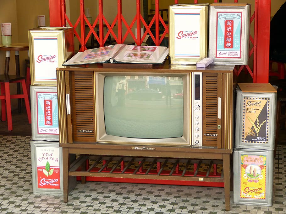 brown vintage tv, television, vintage, antique, tv, old, retro, indoors, text, communication
