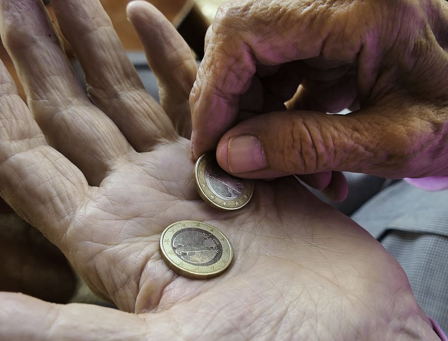 two, round gold-and-silver-colored coins, finger, euro, hands, pension, pensioner, pay, coins, money