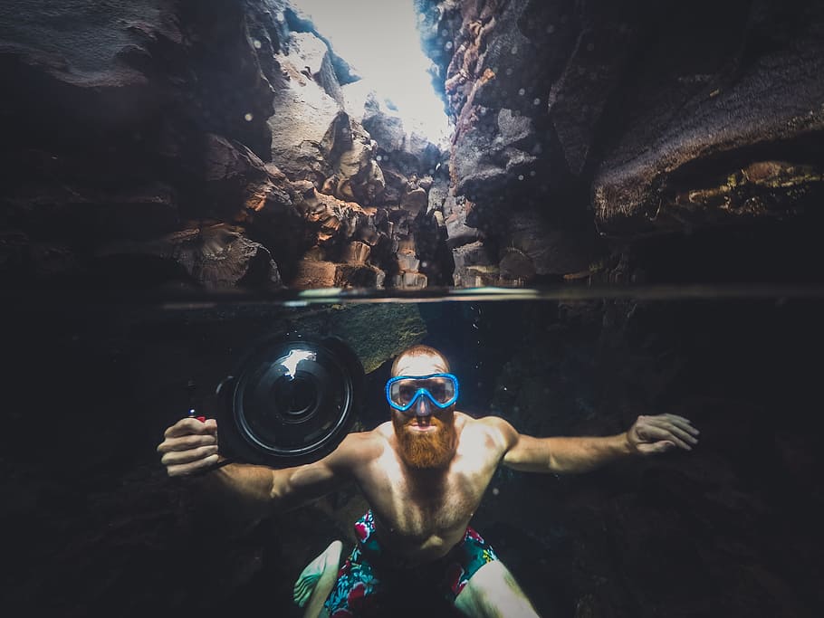 camera, people, man, swimming, water, cave, nature, rocks, one person, shirtless