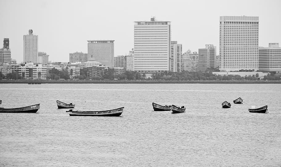 grayscale photo, motor boat, body, water, buildings, greyscale, boats, architecture, city, office