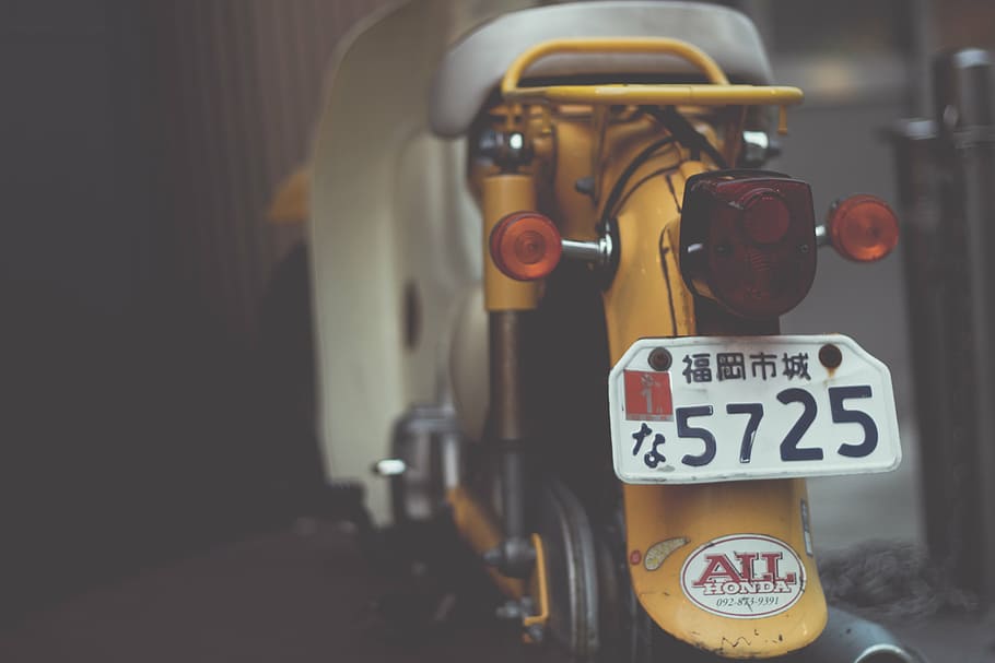 selective, focus photography, yellow, motor scooter, motor, scooter, vehicle, park, plate, number