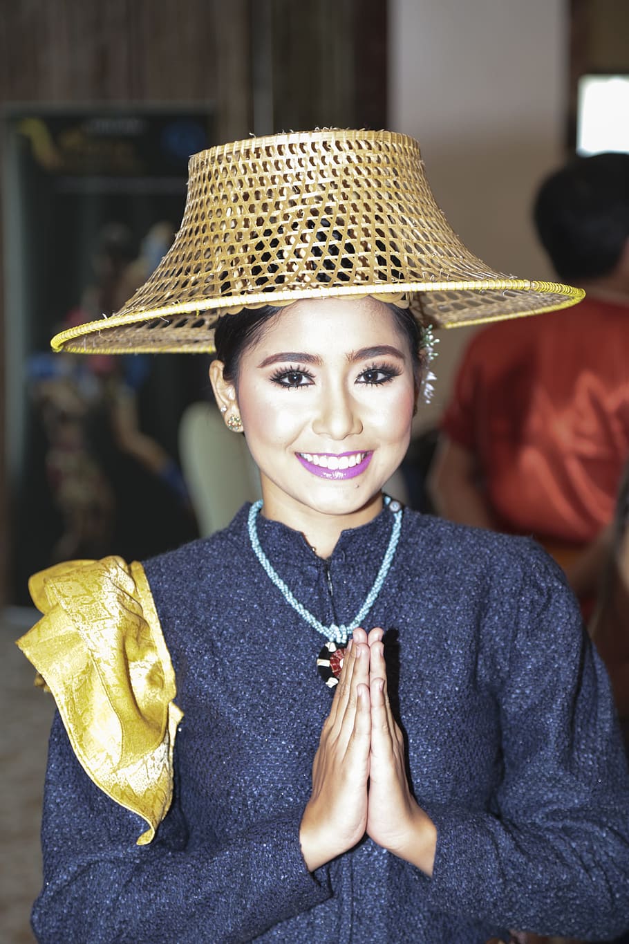 smiling, woman, wearing, black, long-sleeved, zip-up, top, brown, rattan hat, thailand