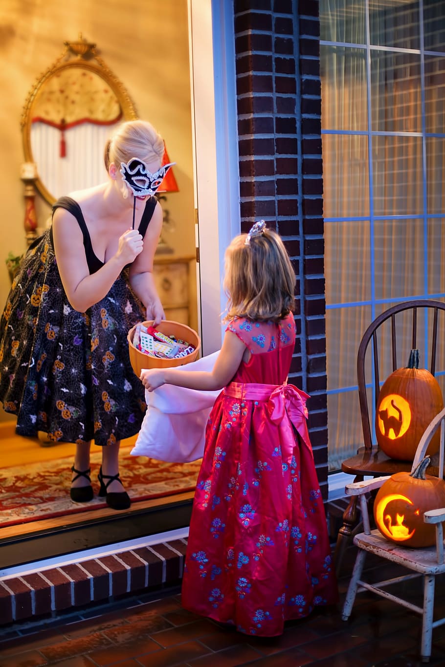 woman, wearing, dress, holding, masquarade mask, halloween, trick-or-treat, pumpkin, child, fall