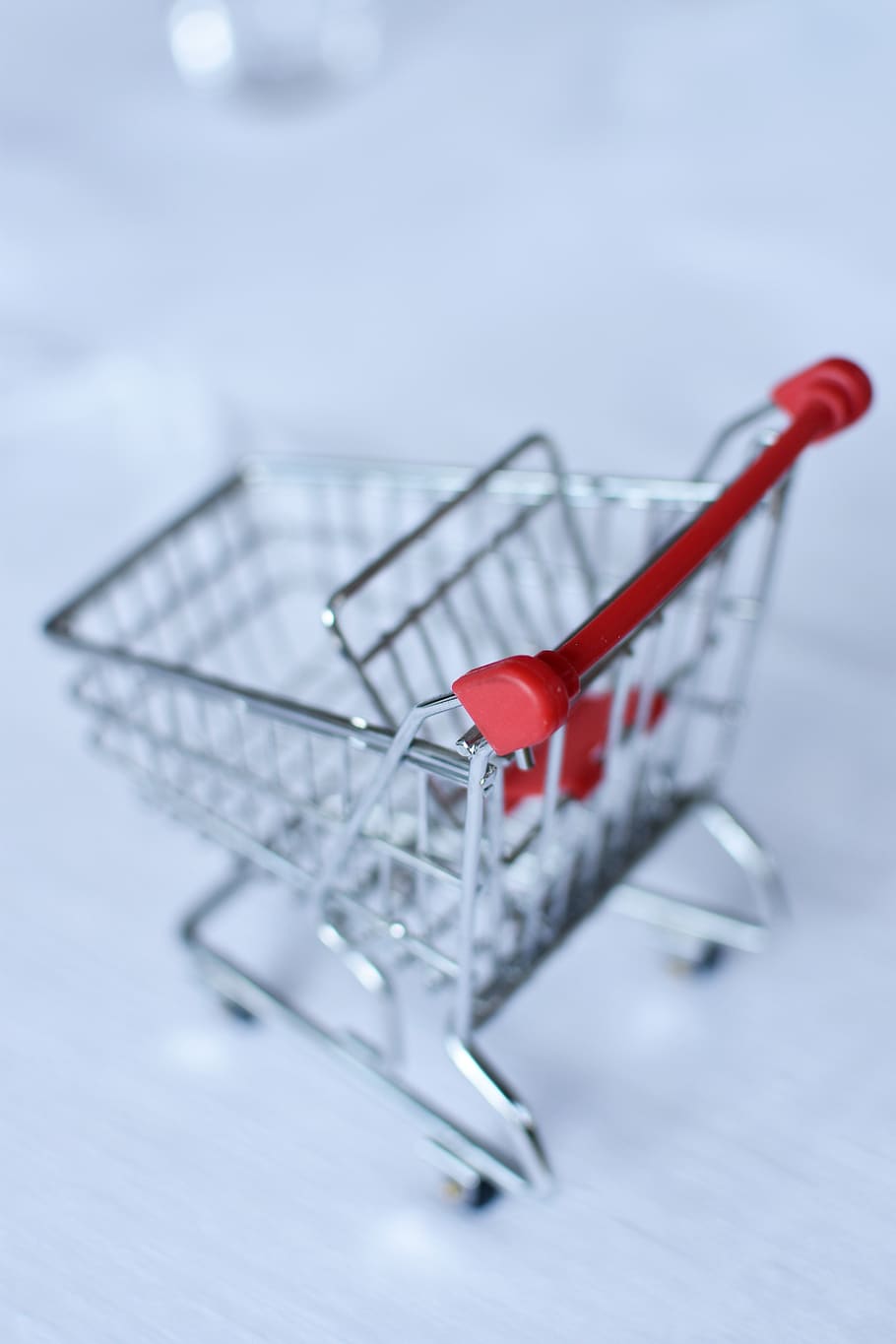 shopping cart, shopping, small, studio shot, indoors, red, close-up, consumerism, selective focus, retail