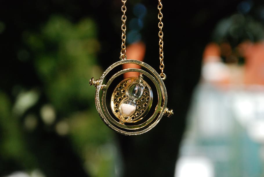 selective, focus, gold-colored, sphere, hour, glass, pendant, necklace, giratiempo, harry potter