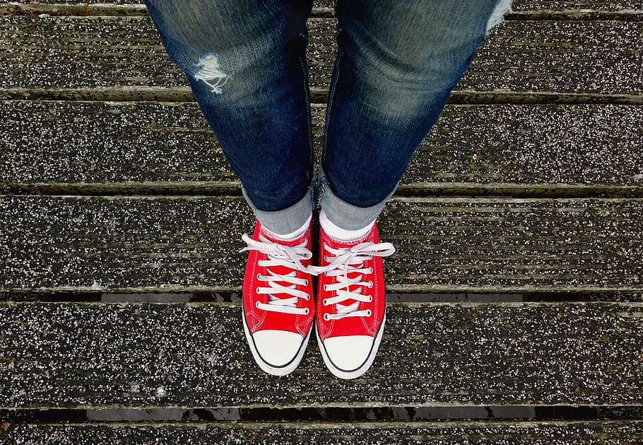 red-and-white, low-top lace-up sneakers, sneakers, feet, shoes, legs, female, woman, fashion, jeans