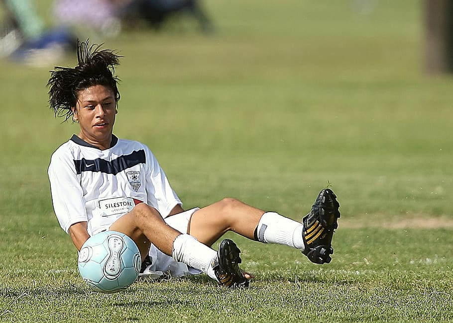 soccer player, lying, grass field, football player, fallen, game, sport, ball, field, grass