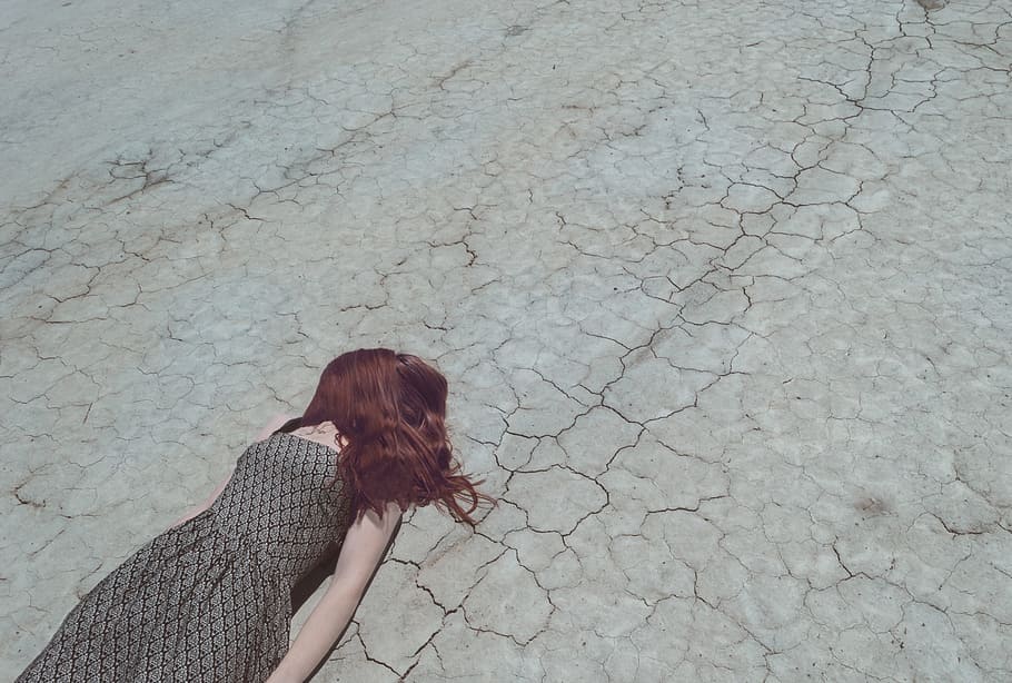 person, grey, black, sleeveless dress, lying, concrete, road, metaphor, falling down, failure