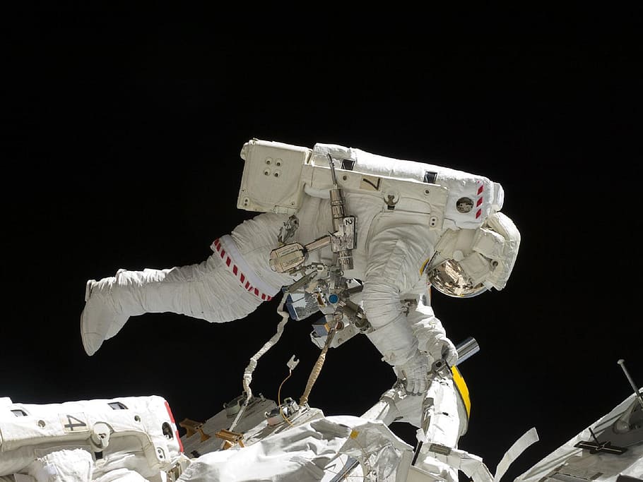 white astronaut, astronaut, spacewalk, iss, tools, suit, pack, tether, floating, international space station