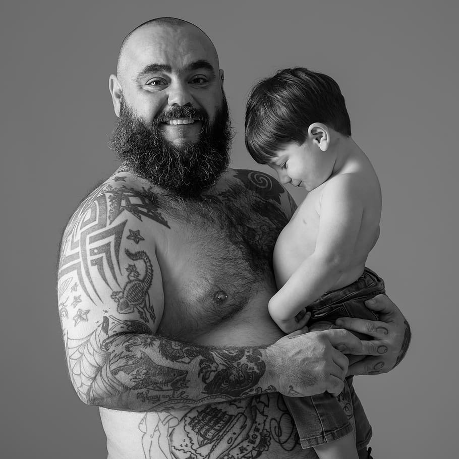 father, son, torso, tattoos, beard, studio shot, two people, indoors, men, young men