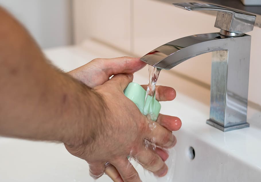 person, holding, green, soap, washing, hands, wash hands, hygiene, faucet, wet