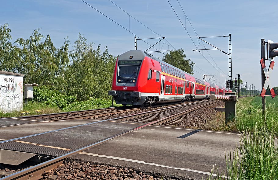 regional-express, double decker, main line, level crossing, barrier, lane, dirt track, andreaskreuz, light characters, railway