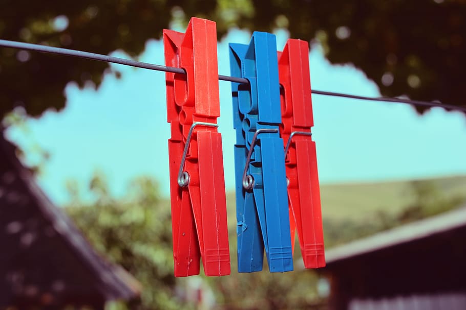 hooks, laundry, wire, plastic, dye, red, blue, hanging, clothespin, focus on foreground