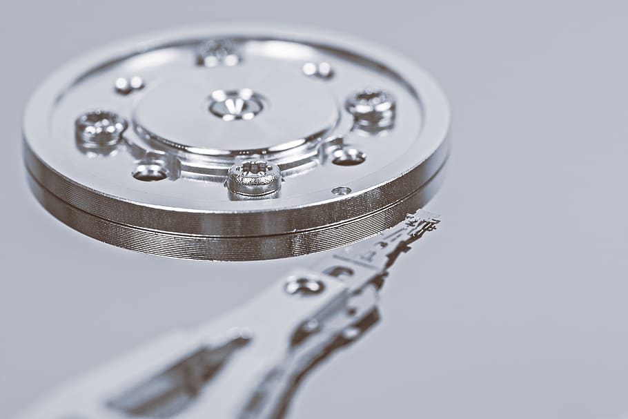 round silver metal component, screws, hard drive, detail, read head, inner workings, macro, memory chip, cut out, hardware
