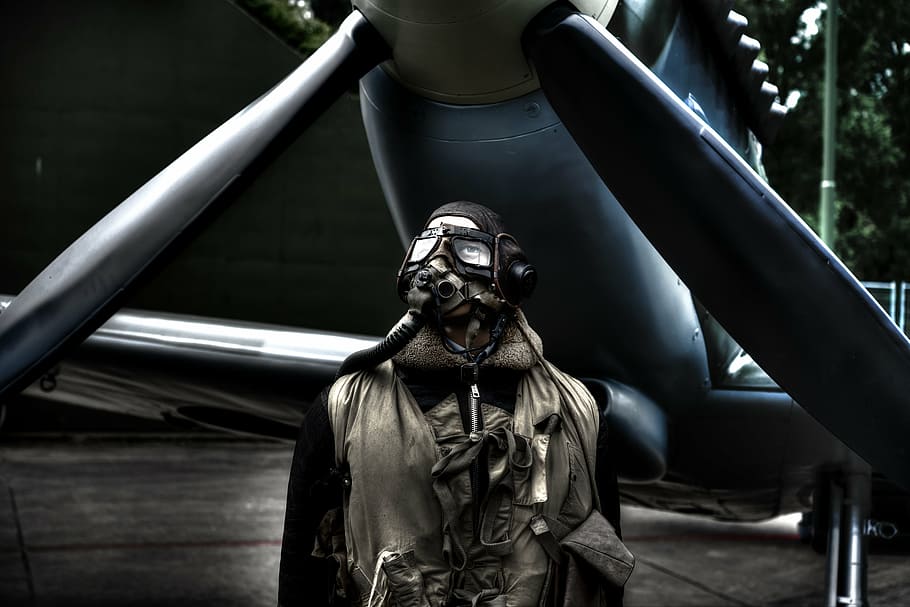man, wearing, mask, suit, pilot, standing, plane, airplane, jacket, flight