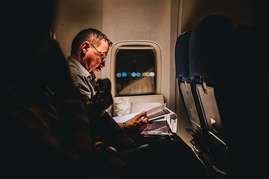 man reading book, inside, plane, airplane, airline, travel, trip, flight, people, man