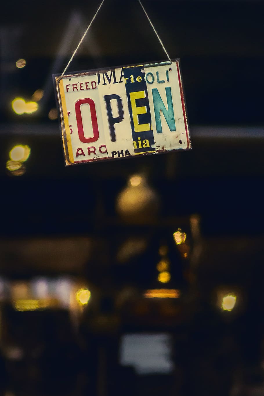 open signage, dark, night, lights, bokeh, blur, open, establishment, glass, inside