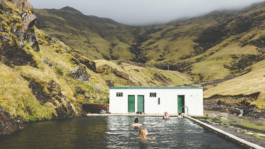house, swimming, pool, white, painted, daytime, mountain, highland, bathroom, people