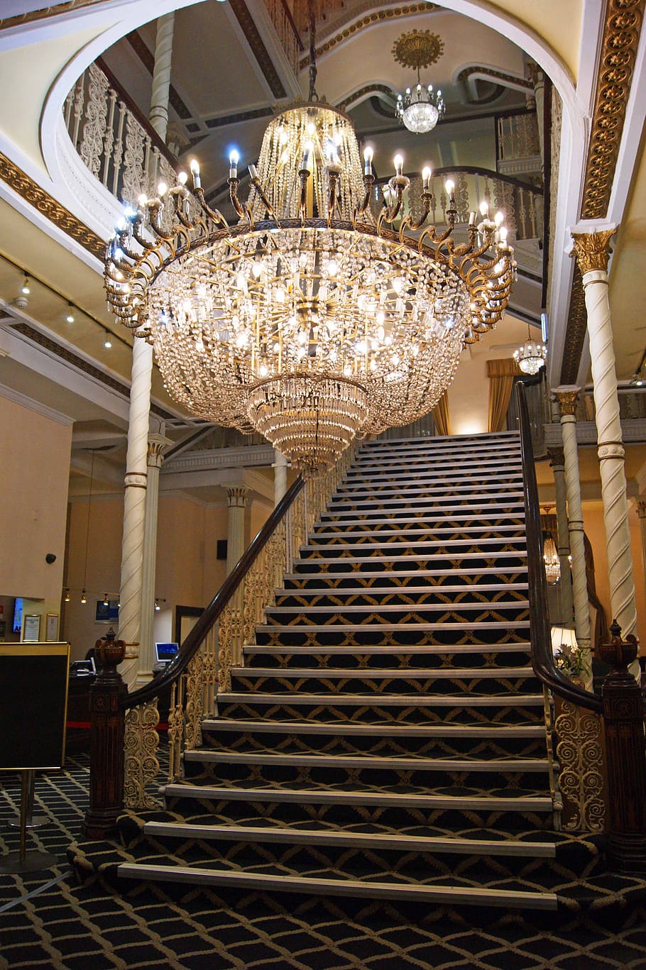 Watch, Trotters, brass-colored crystal chandelier, indoors, lighting equipment, architecture, chandelier, illuminated, staircase, built structure