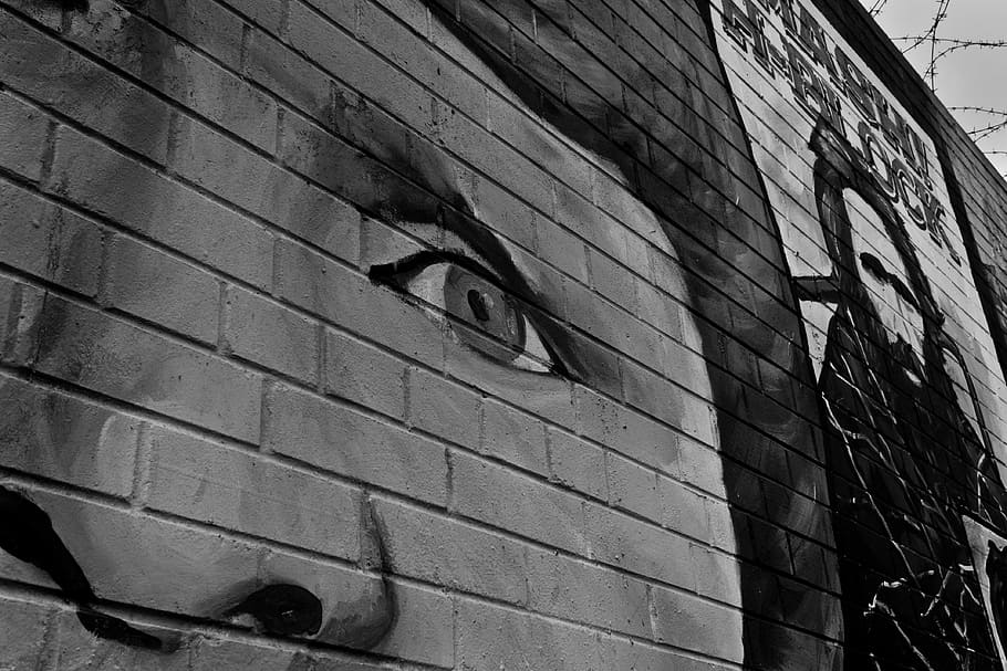 painting, wall greyscale photography, belfast, wall, ireland, sadness, face, eyes, humanity, looking