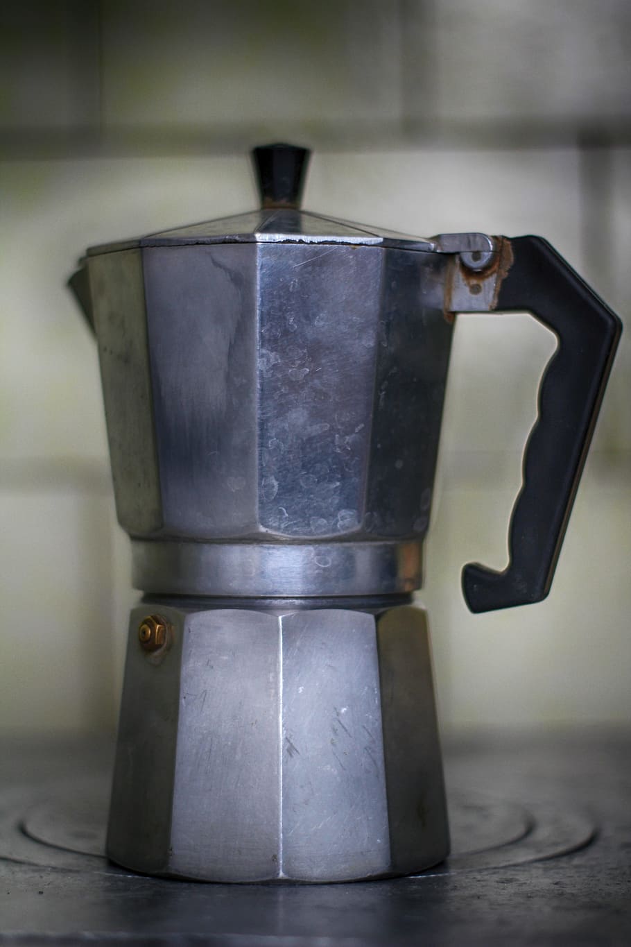 a coffee maker, cuban, coffee, metal, aluminium, drink, plate, old, kitchen, retro