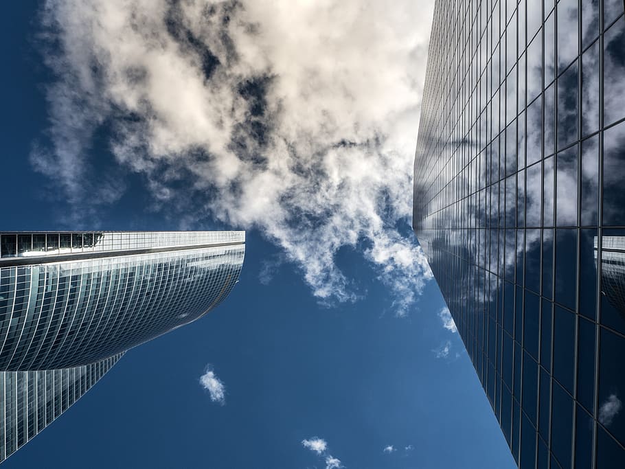 low-angle photo, concrete, high-rise, building, daytime, torres, madrid, sky, clouds, buildings