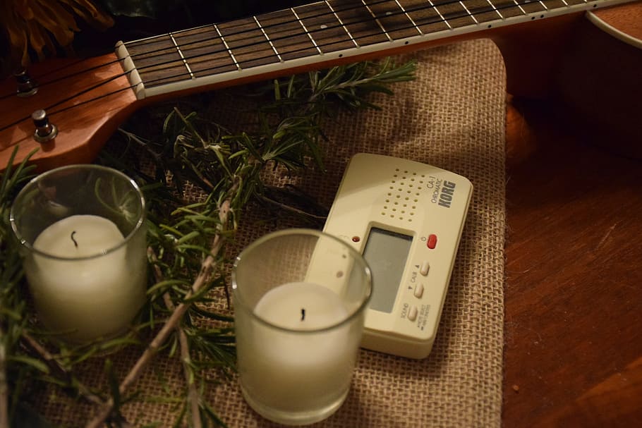 white, thermostat, two, candle jars, table, candles, guitar, tuner, instrument, musical