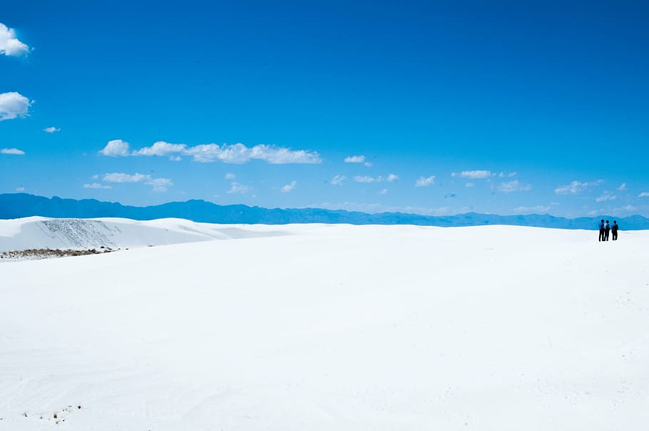 three, people, standing, ice field, white, seashore, blue, sky, sunshine, clouds