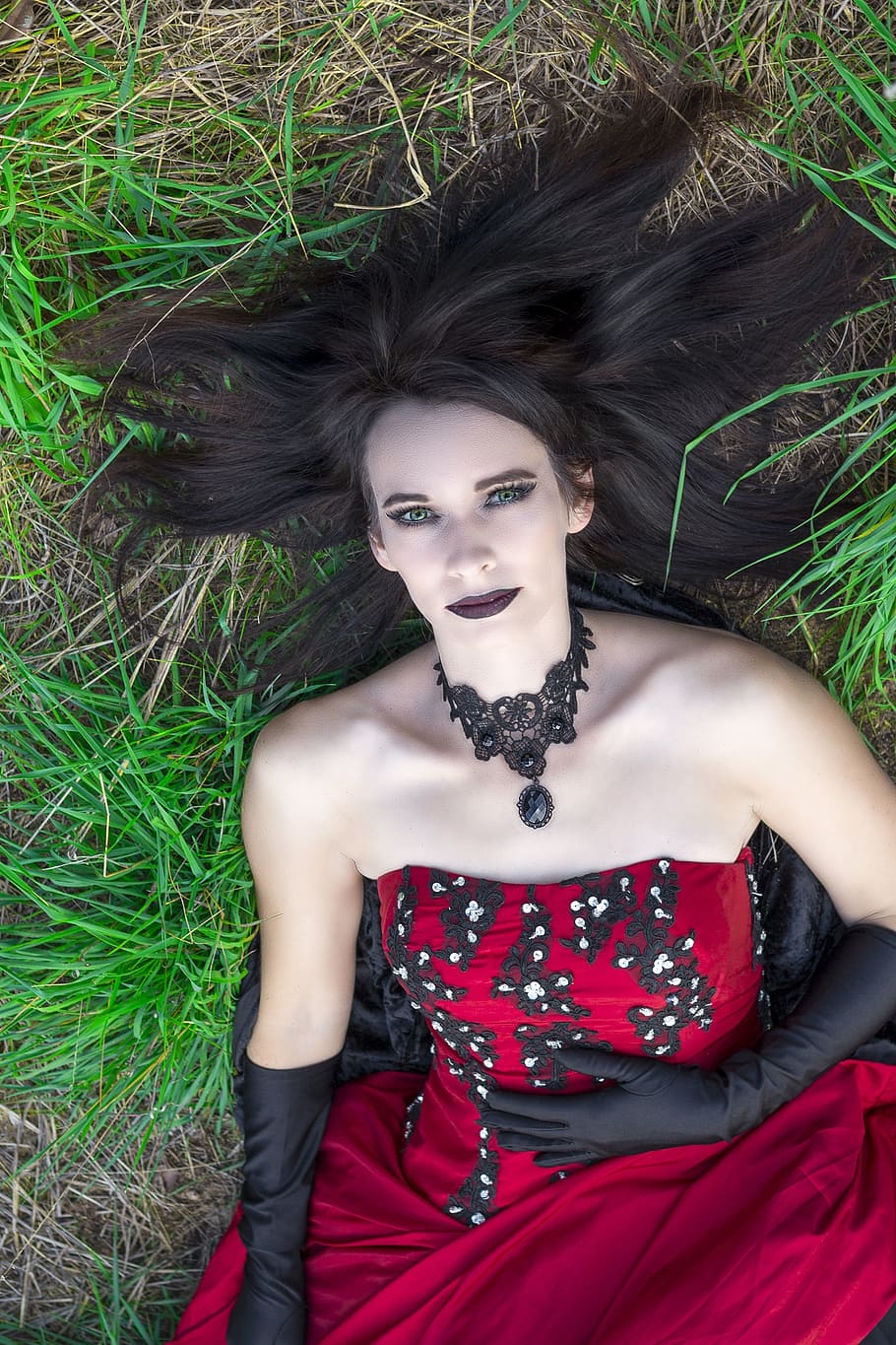woman, wearing, red, black, strapless dress, lying, groun, gothic, dress, fashion